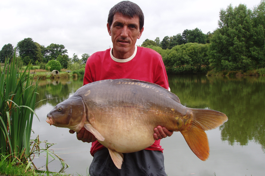 Mirror carp caught at Etang de Azat-Chatenet fishing lake in France