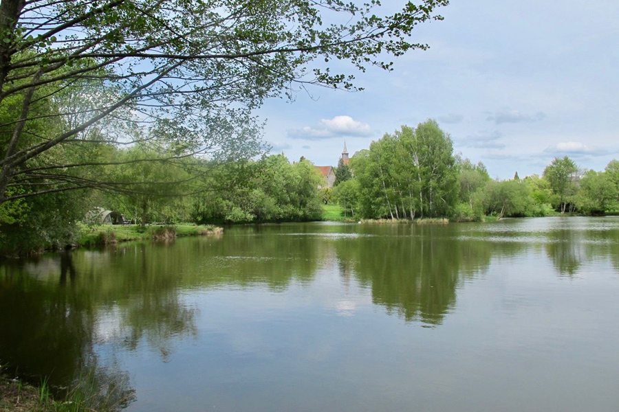 View from the outlet overflow at Etang de Azat-Chatenet fishing lake in France