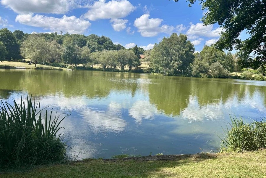 Lake and grounds at Etang de Azat-Chatenet fishing lake in France