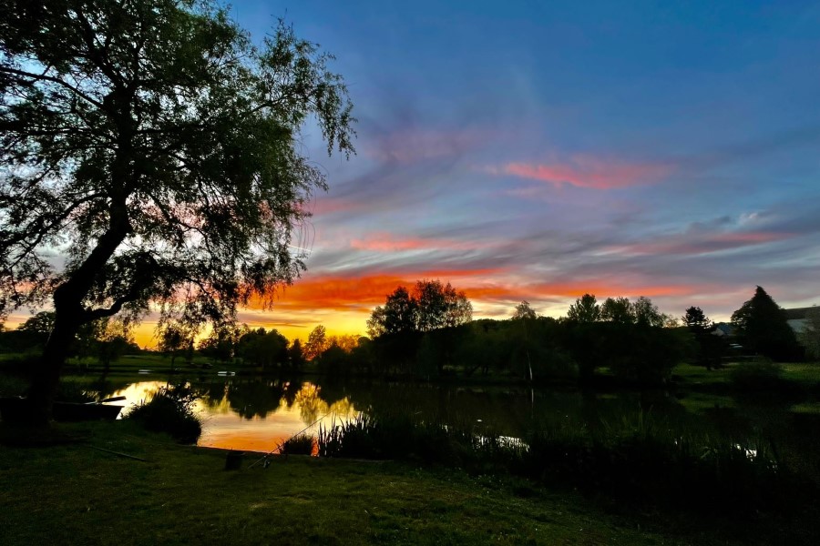 Lake and grounds at Etang de Azat-Chatenet fishing lake in France